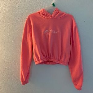 Pink hoodie with words stunt hard in white.